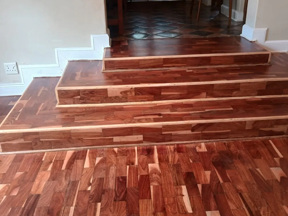 Finished hardwood flooring running up to a run of timber steps