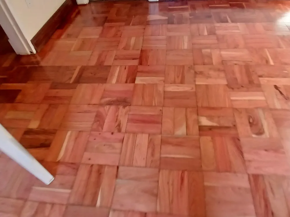 Pale reclaimed parquet blocks laid out and levelled before sanding