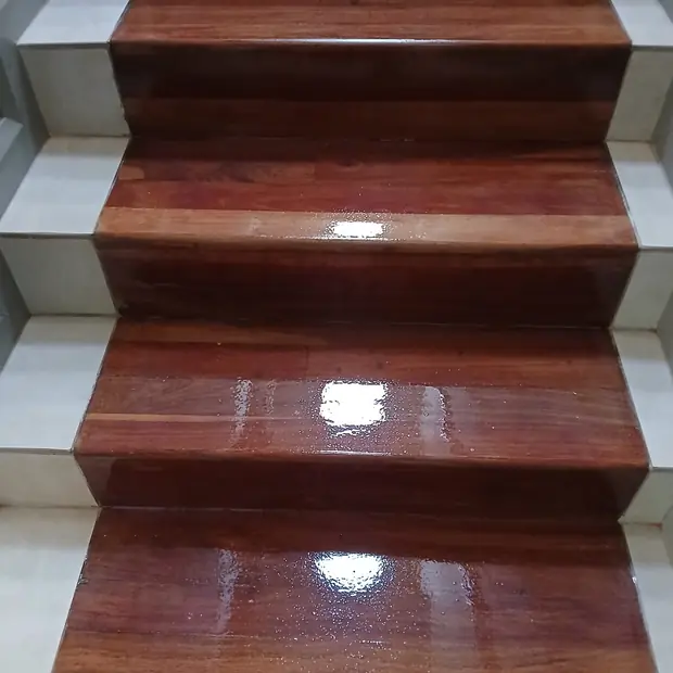 Glossy sealed hardwood stair treads fitted over concrete stairs in Gauteng by Impi Teak
