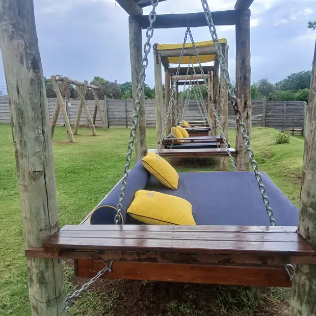 Suspended hardwood swing bench built for a Kyalami garden by Impi Teak
